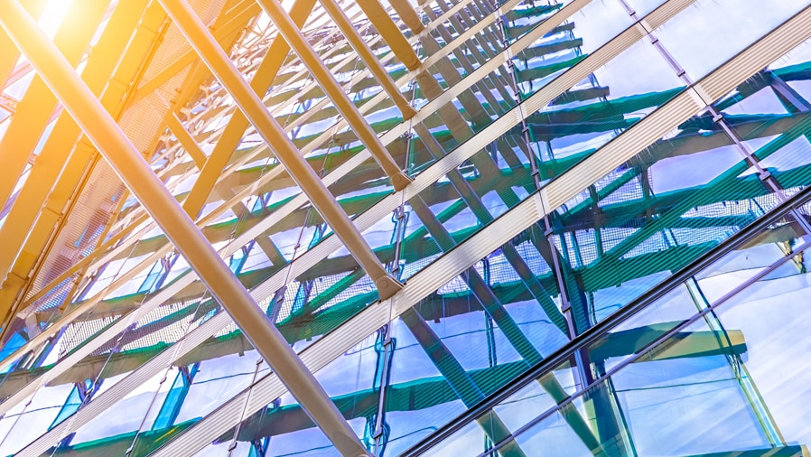 close up of building with sunlight shining through the glass